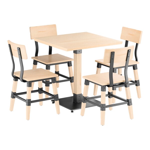 A square wooden table with a bleached oak finish is paired with four matching chairs featuring black metal accents and light wood seats and backs.