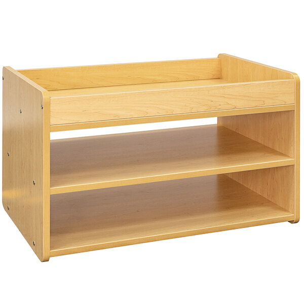 A maple laminate Tot Mate toddler play center with two shelves.