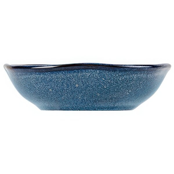 A Tuxton TuxTrendz Artisan Night Sky fruit dish with a wavy rim in blue.