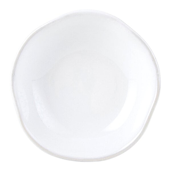 A white Tuxton China fruit bowl with a rim.