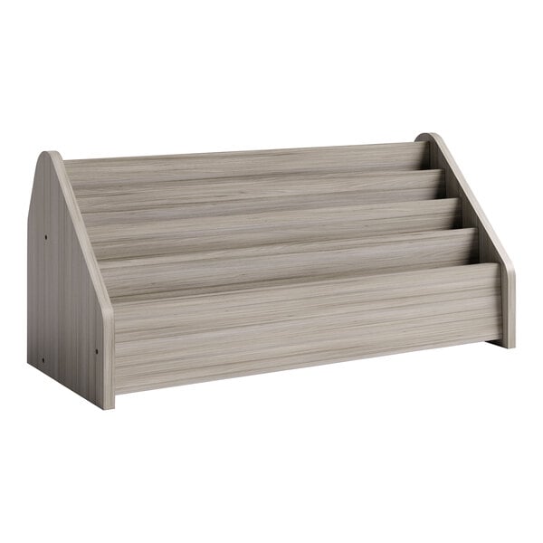 A Tot Mate Shadow Elm laminate book rack with four shelves.