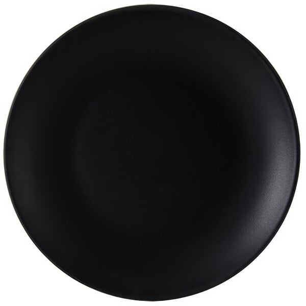 A black Tuxton china plate with a white background.