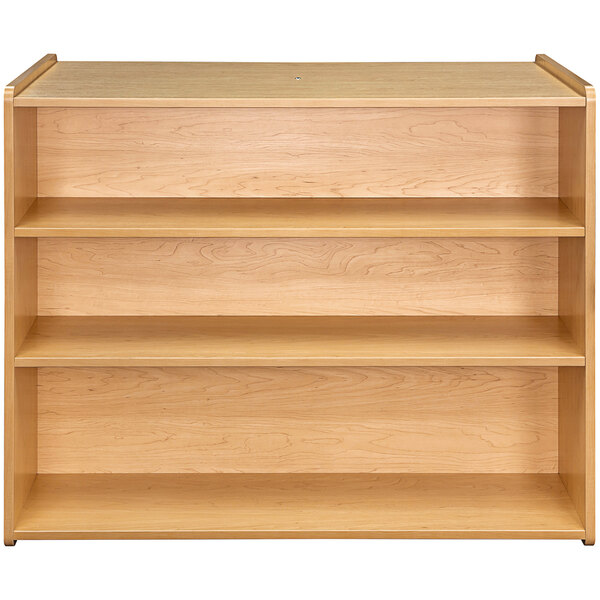 A wooden school age storage shelf with four shelves.