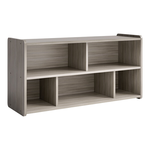 A Tot Mate Shadow Elm laminate toddler compartment storage with shelves.
