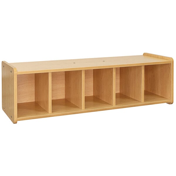 A Tot Mate maple laminate wooden bench with shelves and cubbies.