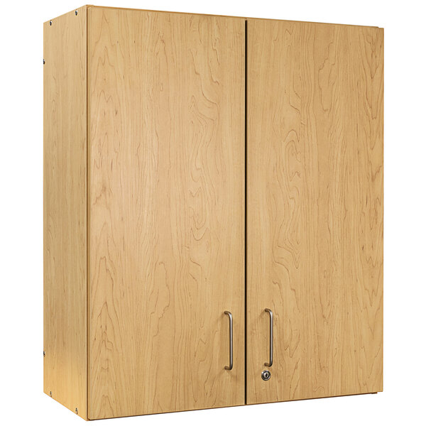 A wooden Tot Mate wall cabinet with silver handles.