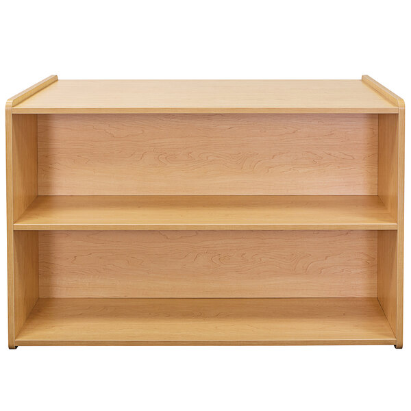 A Tot Mate maple laminate toddler double sided storage shelf with two shelves.