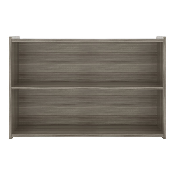 A wooden Tot Mate preschool storage shelf with two shelves.