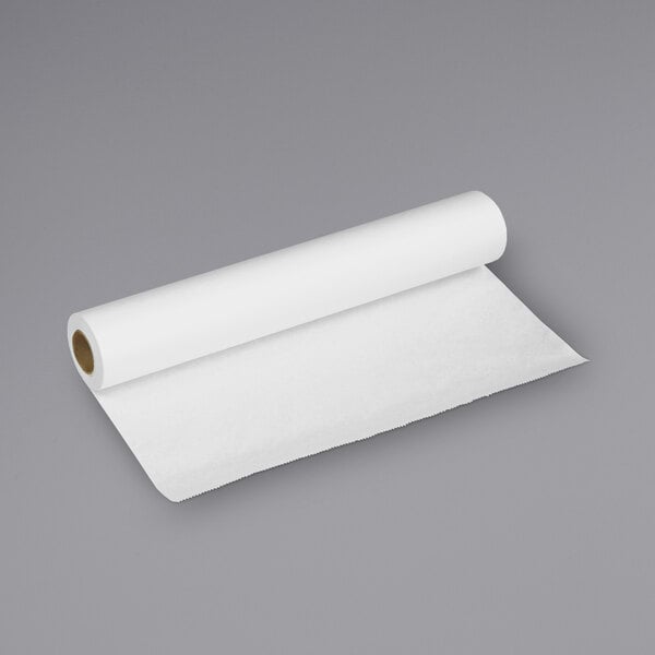 a roll of paper on a gray surface