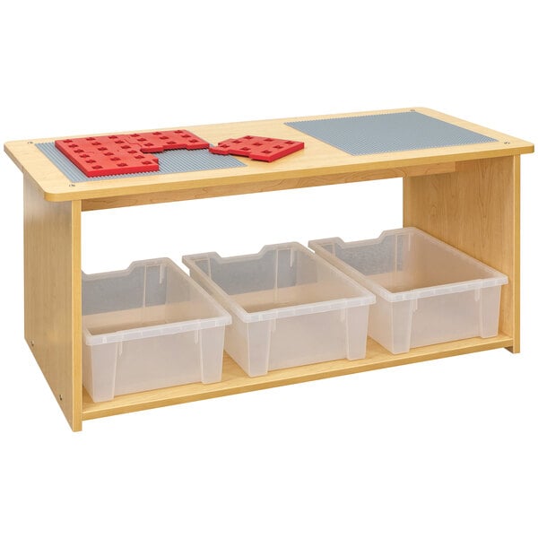 A wooden Tot Mate preschool play center with plastic bins on a shelf.