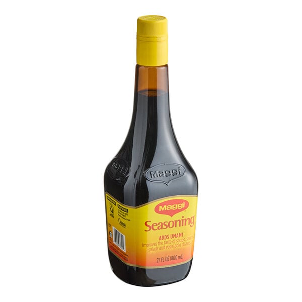 A 27 oz. bottle of Maggi liquid seasoning with a yellow cap and label.