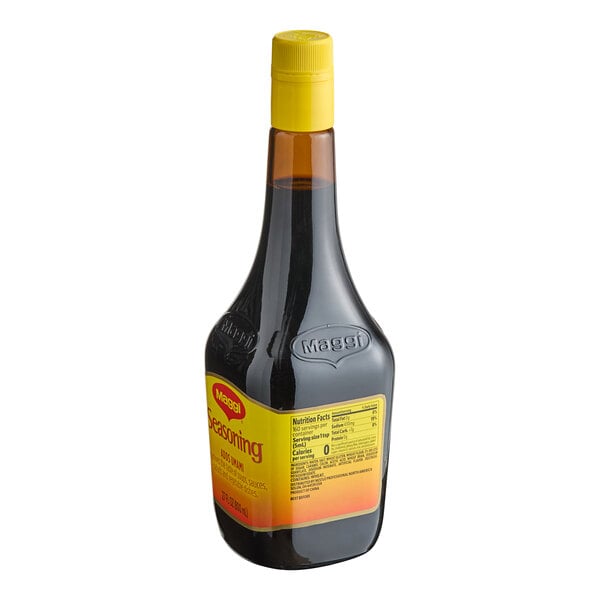 A 27 oz. bottle of Maggi liquid seasoning with a yellow cap and label.