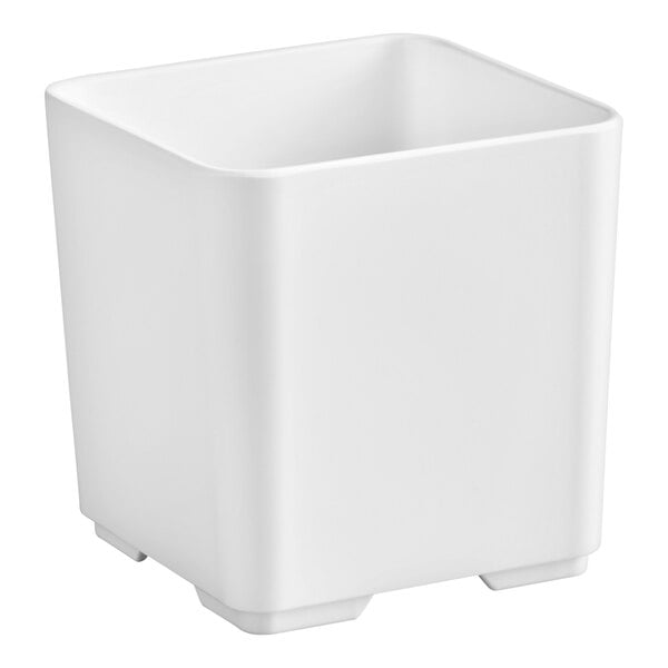 A white, square-shaped container with slightly rounded edges and small feet at the base.