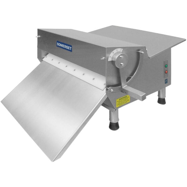 A Somerset dough sheeter with a metal cover.