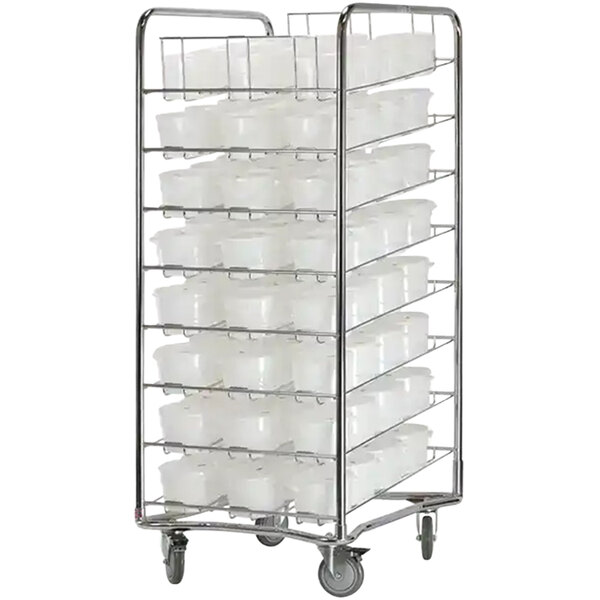 A chrome-plated metal Proluxe dough cart rack with plastic containers and lids on it.