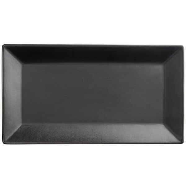 A black rectangular Acopa stoneware platter with a white border.