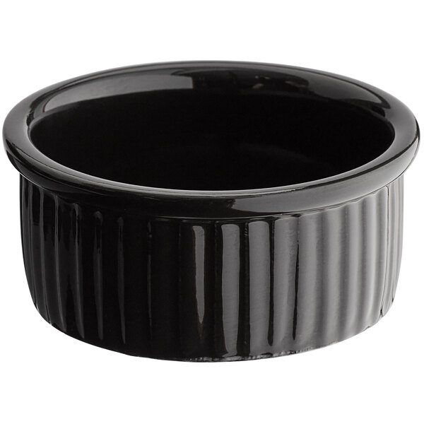 A black fluted stoneware ramekin.