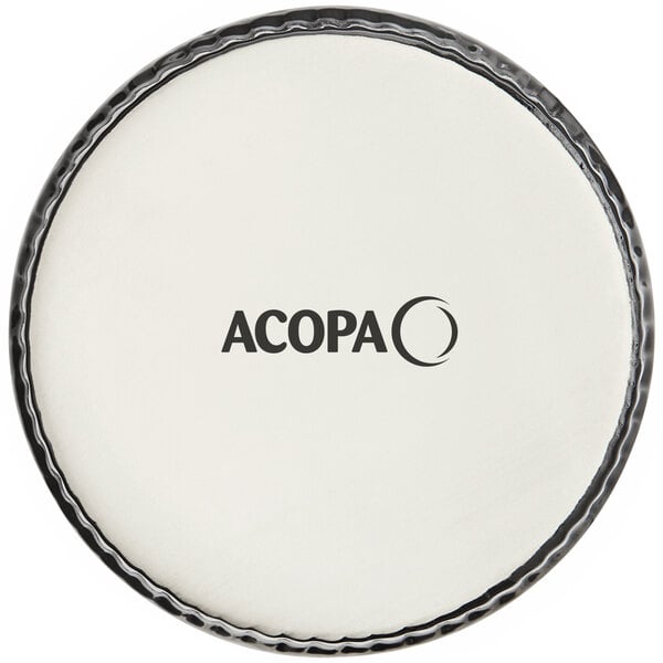 A white drum with the words "Acopa 10 oz. Round Glossy Black Fluted Stoneware Souffle / Creme Brulee Dish" in black text.