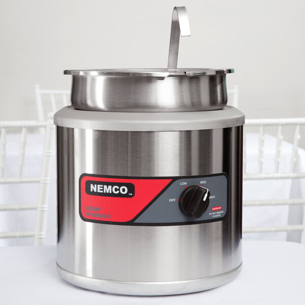 A stainless steel Nemco inset kit with a lid on top.