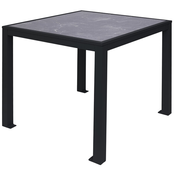 A BFM Seating standard height table with a black marble pietro top and black aluminum legs.