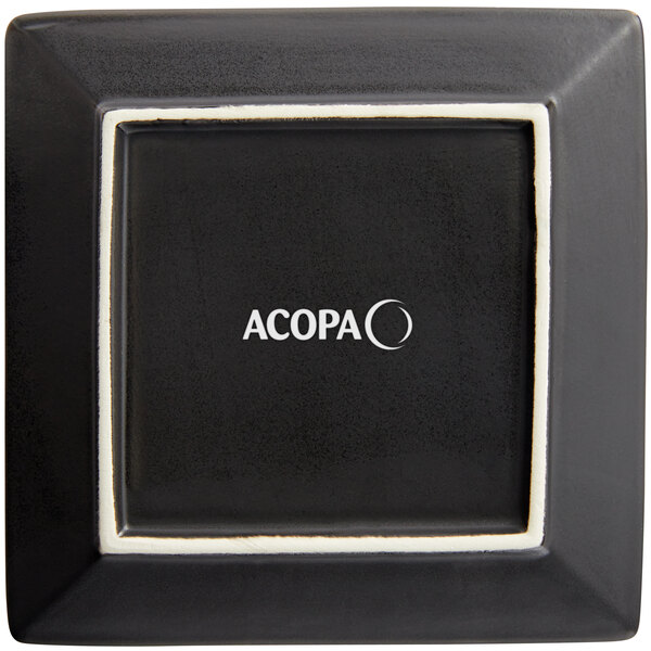 A black square Acopa stoneware plate with white trim.