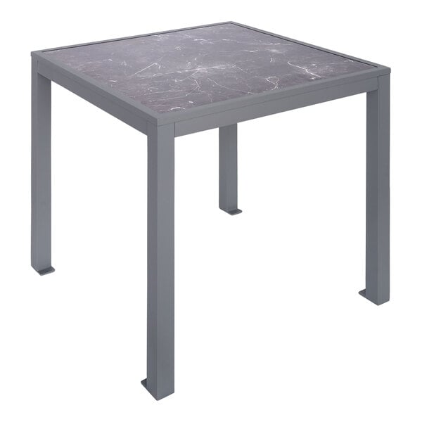 A BFM Seating Surf table with a soft gray aluminum marble top.