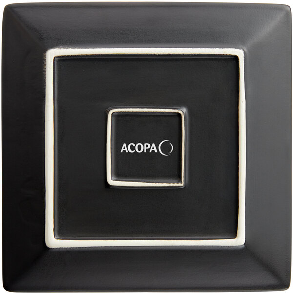 An Acopa matte black square stoneware plate with white trim.