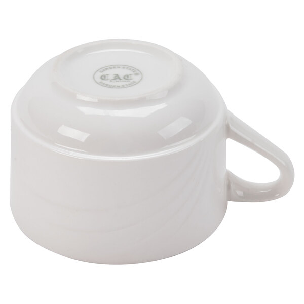 A CAC white porcelain coffee cup with a handle.