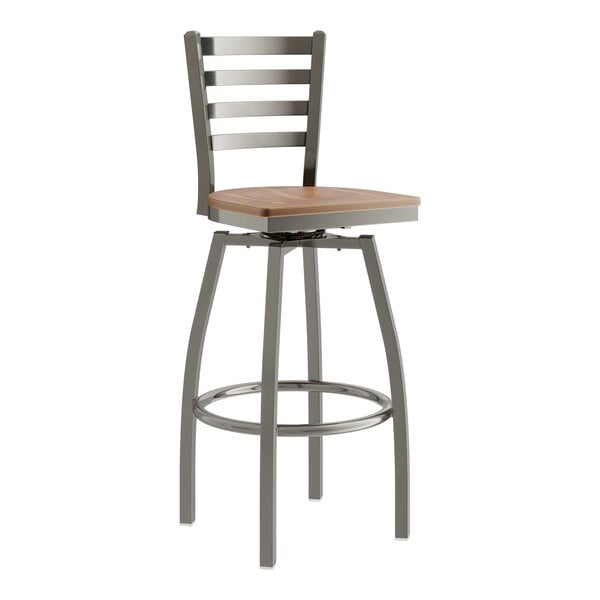 A Lancaster Table & Seating metal bar stool with a vintage wood seat.
