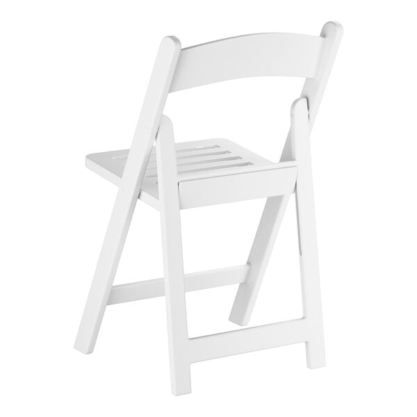 A white resin folding chair with a slatted seat.