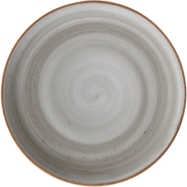 A white porcelain coupe plate with a brown rim.