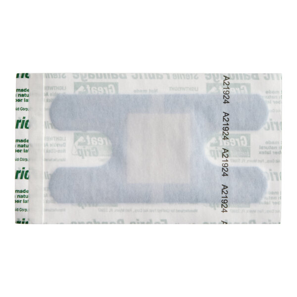 A blue woven adhesive knuckle bandage in its packaging.