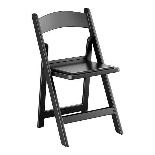 A black resin folding chair with a vinyl seat.