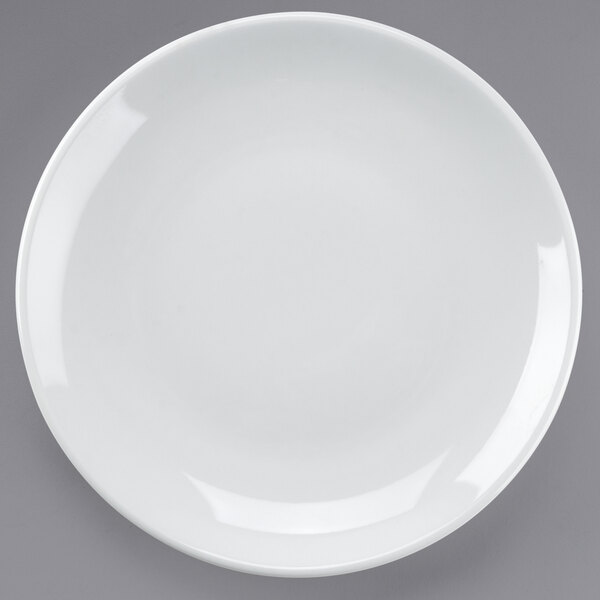 A Tuxton bright white coupe china plate on a white background.
