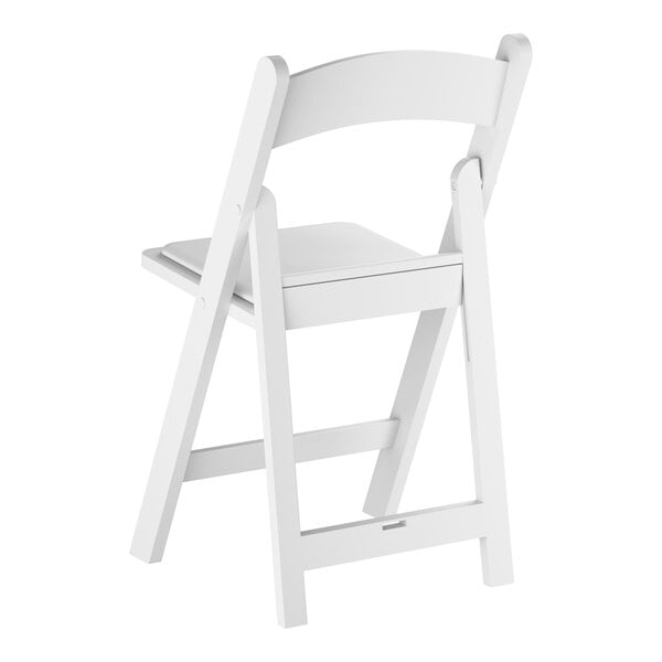 A white resin folding chair with a vinyl seat.
