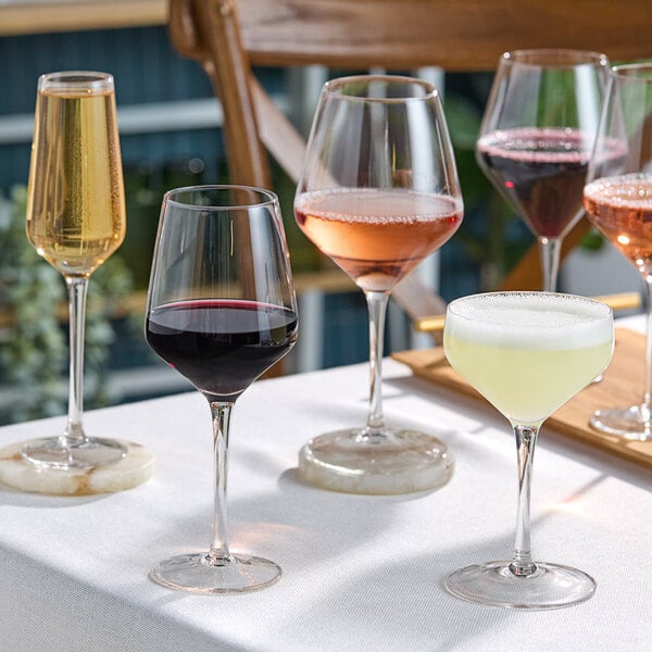 Acopa Silhouette wine glasses on a table.