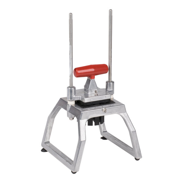 A tabletop-mounted fruit and vegetable corer with a red handle and metal frame, designed to cut produce into six sections.