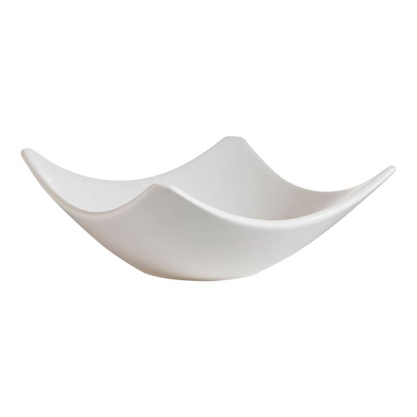 A CAC bone white square porcelain dish with a curved edge.