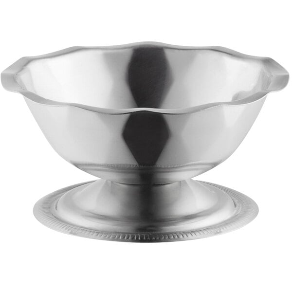 A Vollrath stainless steel round paneled sherbet dish with a round base.