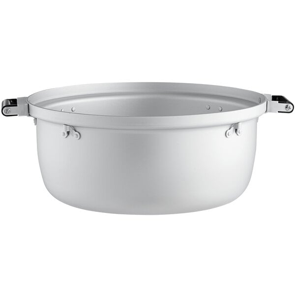 A white pot with black handles.