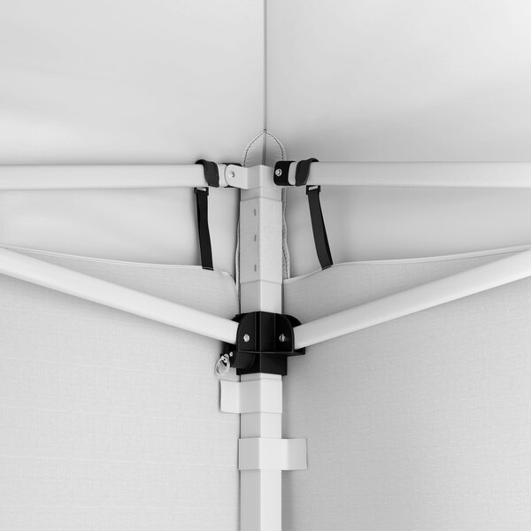 A close-up view of the interior frame and corner joint of a white steel pop-up canopy tent with attached fabric side walls.