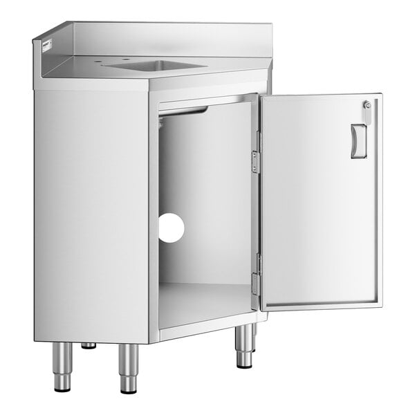 A stainless steel corner work table with a built-in sink, an open hinged door revealing storage space underneath, and four adjustable legs.