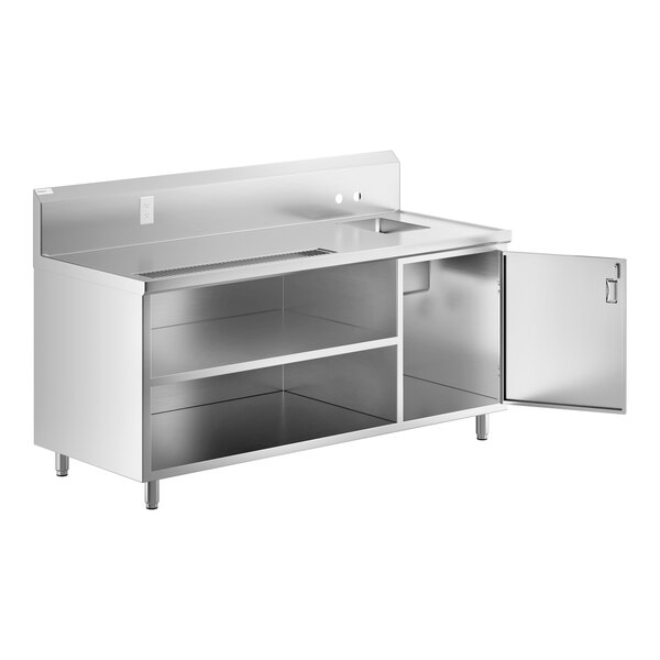 A Regency stainless steel beverage table with a sink and door open.