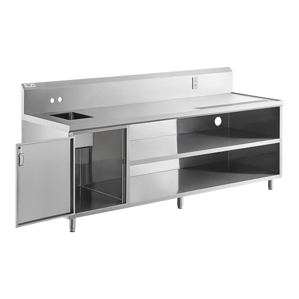 A Regency stainless steel beverage table with a sink and shelves.