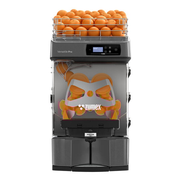 A Zumex Versatile Pro automatic feed juicer with oranges on top.