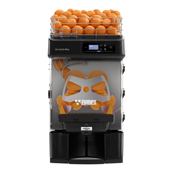 A Zumex Versatile Pro juicer with oranges in it.
