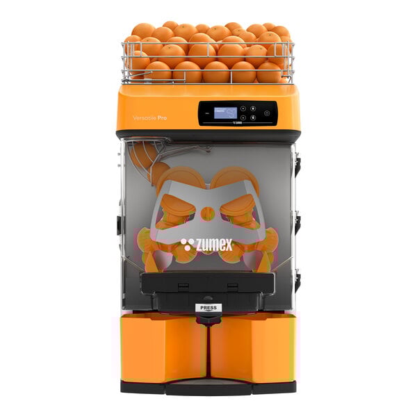 A Zumex Versatile Pro automatic feed juicer with oranges on top.