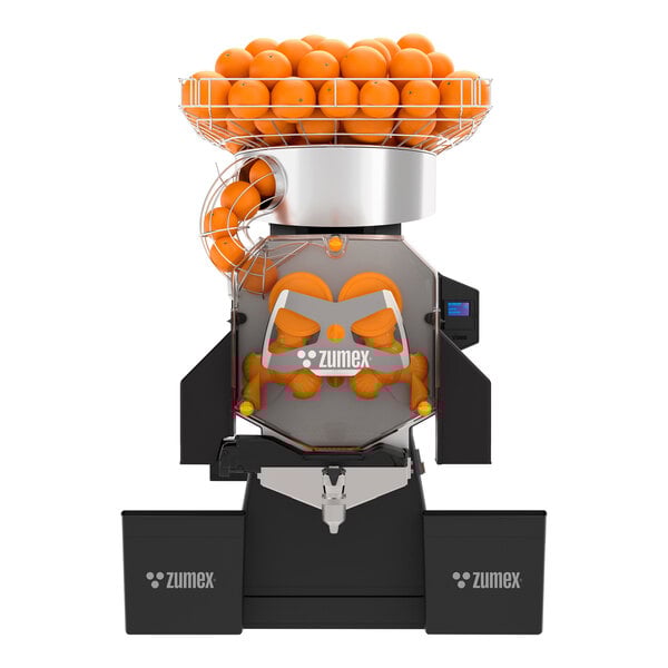 A Zumex Speed S+ juicer with oranges in it.