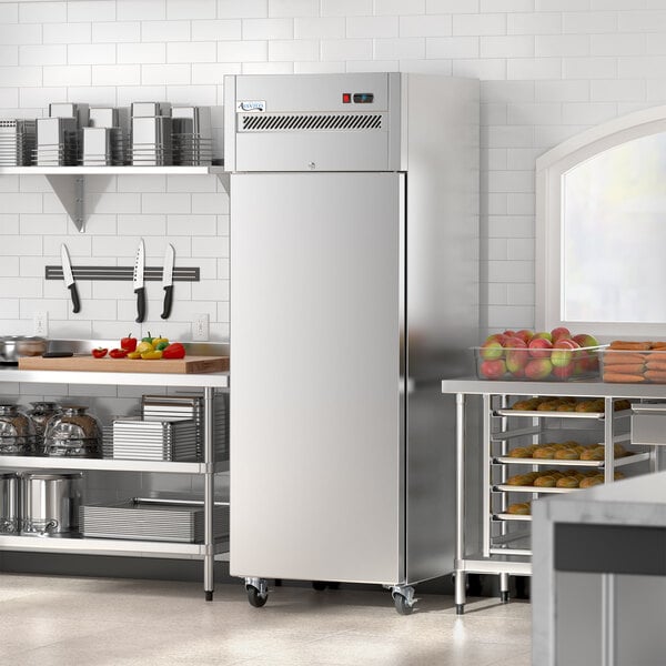 An Avantco stainless steel reach-in freezer in a kitchen.