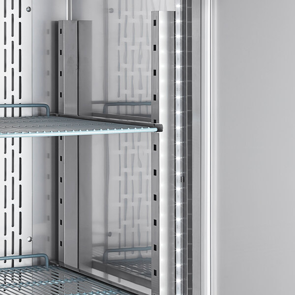 A stainless steel reach-in refrigerator with adjustable wire shelves and a right-hinged glass half door.